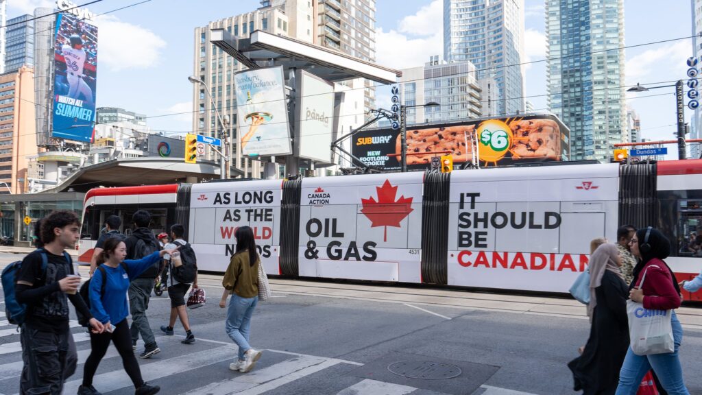 A full-wrap Canada Action ad appears on a Toronto streetcar. Credit: OilsandsAction / Twitter