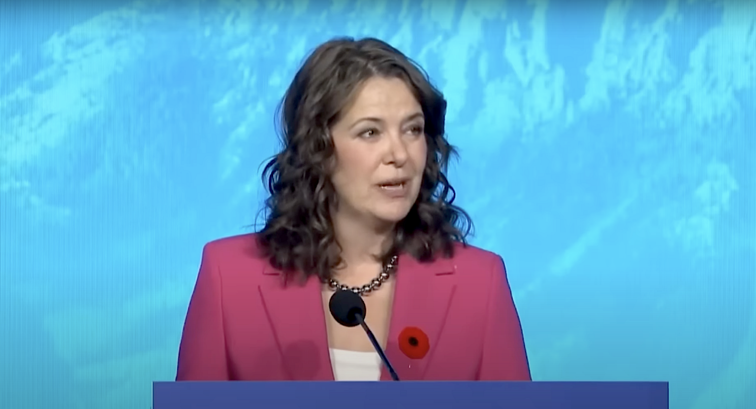 Premier Danielle Smith speaks at the UCP annual meeting, where delegates voted for an erroneous resolution claiming atmospheric CO2 is at a 1,000-year low.