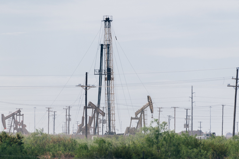 Active oilfield near a new housing development in Midland, Texas.